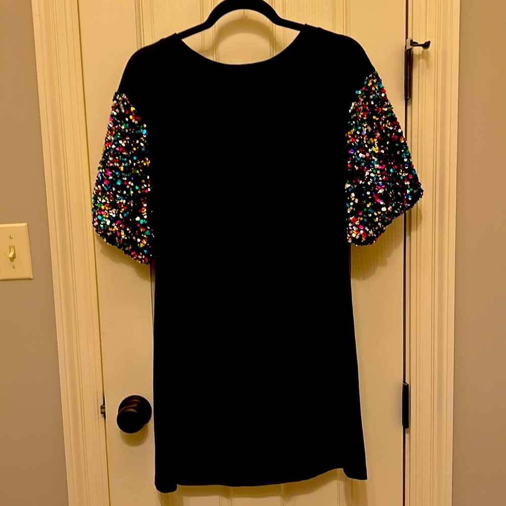 Black T-shirt dress with poof sequined sleeves. Like new never worn.